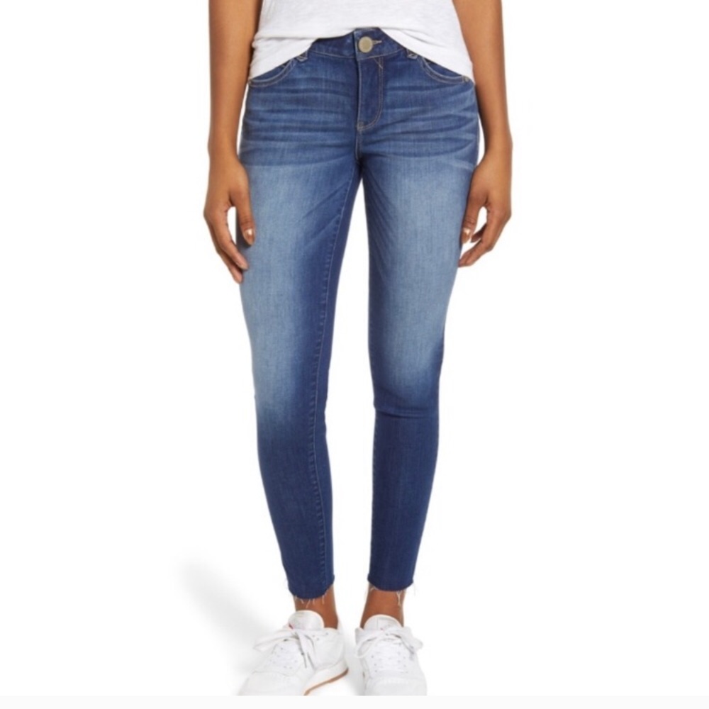 Dark wash. Raw hem skinny jean